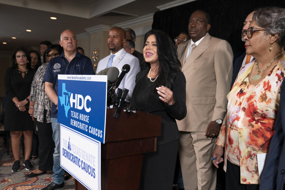 Democratic Texas State Rep. Victoria Neave from Dallas, center, together with his fellow Texas legislators, speaks during a news conference, Wednesday, July 14, 2021, in Washington. (AP Photo/Manuel Balce Ceneta)