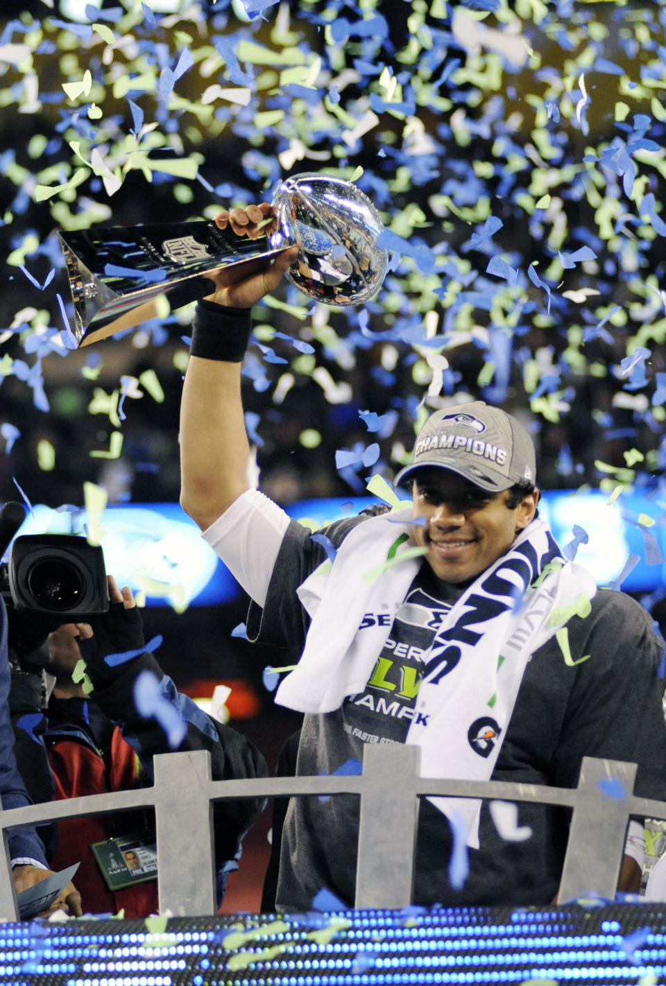 EAST RUTHERFORD, NJ - FEBRUARY 02:  Quarterback Russell Wilson #3 of the Seattle Seahawks holding the Lombardi Trophy after they defeated the Denver Broncos in Super Bowl XLVIII on February 2, 2014 at MetLife Stadium in East Rutherford, New Jersey. The Seahawks won the game 43-8. / Credit: Focus On Sport / Getty Images