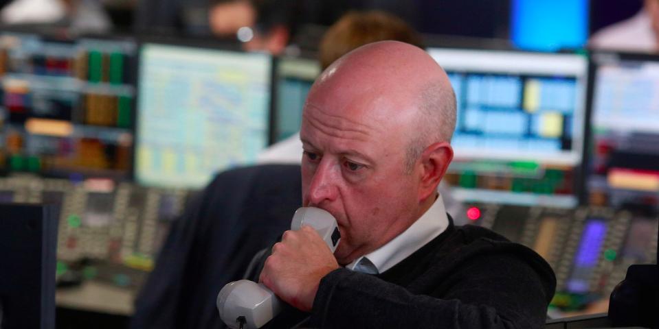 A trader from BGC Partners, a global brokerage company in London's Canary Wharf financial centre waits for European stock markets to open early June 24, 2016 after Britain voted to leave the European Union in the EU BREXIT referendum.