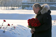 Russian President Vladimir Putin takes part at a wreath laying ceremony at the Piskaryovskoye Cemetery, in St. Petersburg, Russia, Sunday, Jan. 27, 2019, where most of the Leningrad Siege victims were buried during World War II. The Russian city of St. Petersburg marked the 75th anniversary of the end of the World War II siege by Nazi forces. The siege of the city, then called Leningrad, lasted nearly two and a half years until the Soviet Army drove the Nazis away on Jan. 27, 1944. (Mikhail Klimentyev, Sputnik, Kremlin Pool Photo via AP)