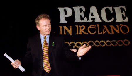 FILE PHOTO: Sinn Fein Chief Negotiator Martin McGuinness speaks to reporters at a news conference February 26, 1998. REUTERS/Paul Hackett/File Photo