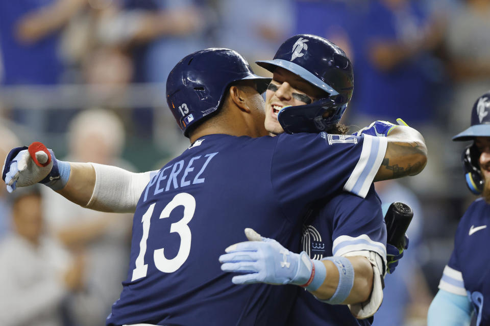 Kansas City Royals' Bobby Witt Jr., right, celebrates with Salvador Perez (13) after hitting a two-run home run against the New York Yankees during the seventh inning of a baseball game in Kansas City, Mo., Friday, Sept. 29, 2023. (AP Photo/Colin E. Braley)