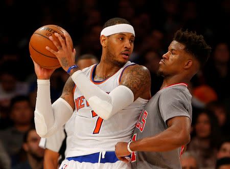 Dec 19, 2015; New York, NY, USA; New York Knicks forward Carmelo Anthony (7) looks to make a move on Chicago Bulls guard Jimmy Butler (21) during second half at Madison Square Garden. The New York Knicks defeated the Chicago Bulls 107-91. Mandatory Credit: Noah K. Murray-USA TODAY Sports