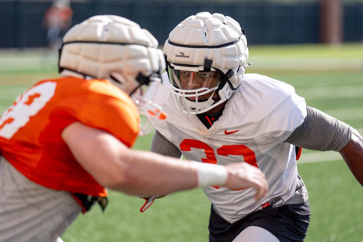 Obi Ezeigbo (33) runs drills during an Oklahoma State football practice in Stillwater, Okla., on Saturday, Aug. 3, 2024.