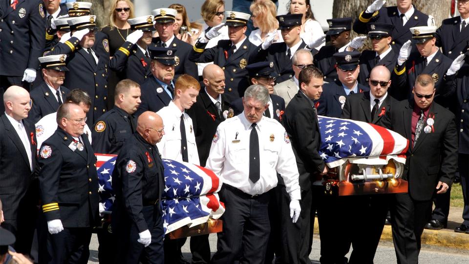 The Salisbury Fire Department escorts the bodies of Victor Isler and Justin Monroe, at their funeral Thursday, March 13, 2008, in Salisbury, N.C. Firefighters Monroe and Isler lost their lives in a five-alarm fire in Salisbury, N.C. , earlier this week. (AP Photo/The Salisbury Post, Sean Meyers)