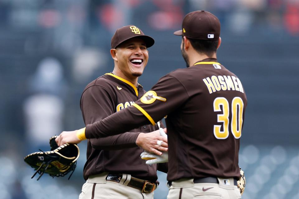 Manny Machado and Eric Hosmer celebrate a win against Cleveland.