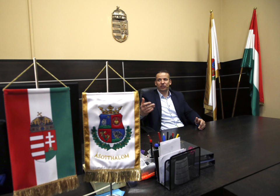 In this photo taken Monday, April 8, 2019, Asotthalom mayor Laszlo Toroczkai speaks during an interview with The Associated Press in the village Asotthalom, Hungary. With a campaign centered on stopping immigration, Hungary’s ruling Fidesz party is expected to continue its dominance in the European Parliament election at the end of May. Torczkai, who is critical of government corruption and some of Hungarian Prime Minister Viktor Orban's economic policies, still appreciates the border fence that Orban built to stop migrants from entering the country. Torczkai says: “On this we agree _ migration must be stopped. (AP Photo/Darko Vojinovic)