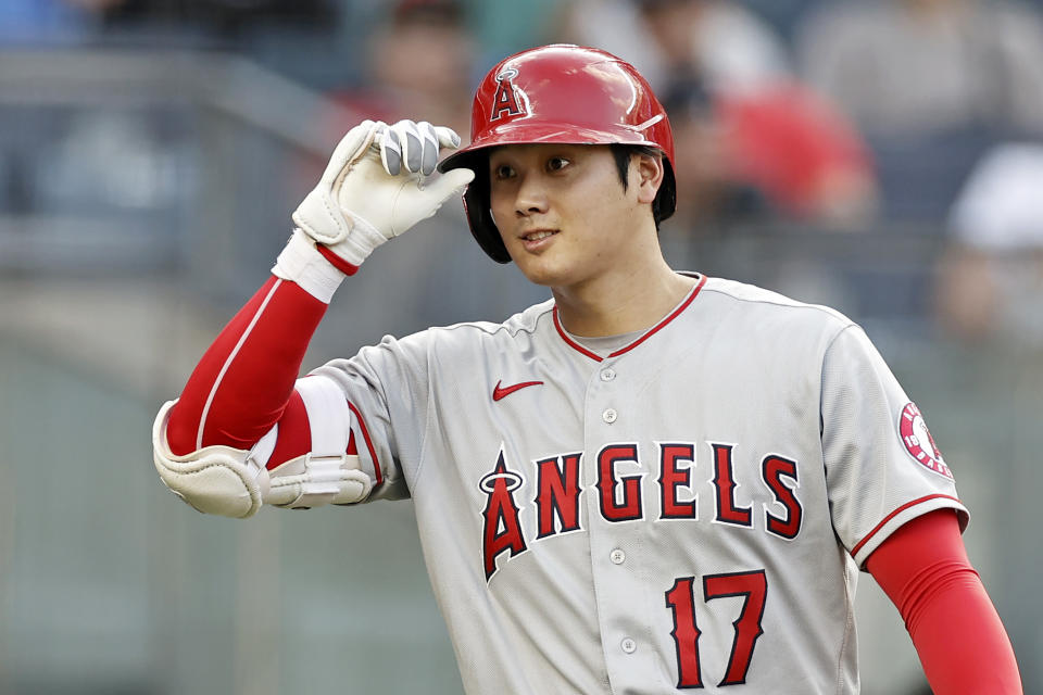 Los Angeles Angels' Shohei Ohtani tips his cap toward the New York Yankees' dugout before batting during the first inning of a baseball game Wednesday, June 30, 2021, in New York. (AP Photo/Adam Hunger)