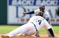 DETROIT, MI - APRIL 22: Miguel Cabrera #24 of the Detroit Tigers is tagged out at second base after stretching a single in the third inning by Elvis Andrus #1 of the Texas Rangers during the game at Comerica Park on April 22, 2012 in Detroit, Michigan. (Photo by Leon Halip/Getty Images)