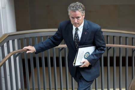 FILE PHOTO: Senator Rand Paul (R-KY) departs after a briefing by Secretary of State Rex Tillerson and Secretary of Defense James Mattis before the Senate Foreign Relations Committee on the ongoing fight against the Islamic State, on Capitol Hill in Washington, U.S., August 2, 2017. REUTERS/Aaron P. Bernstein/File Photo