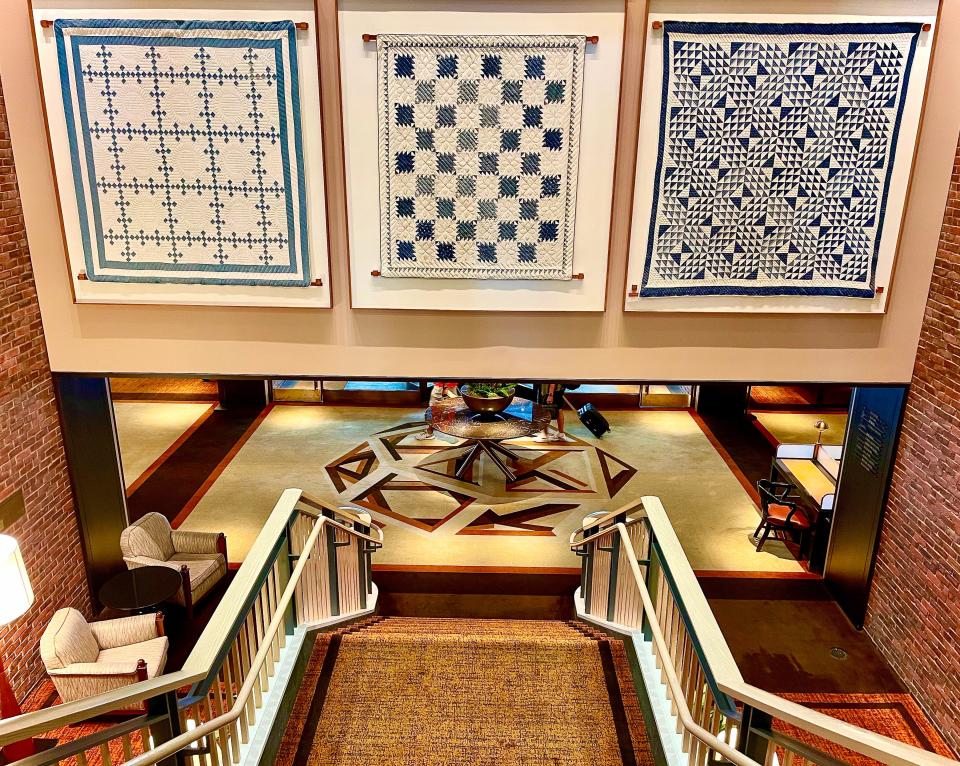 The Charles Hotel’s collection of pretty traditional quilts hangs in the hallways.