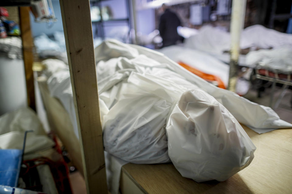 Bodies are wrapped in protective plastic in a holding facility at Daniel J. Schaefer Funeral Home, Thursday, April 2, 2020, in the Brooklyn borough of New York. The company is equipped to handle 40-60 cases at a time. But amid the coronavirus pandemic, it was taking care of 185 Thursday morning. (AP Photo/John Minchillo)