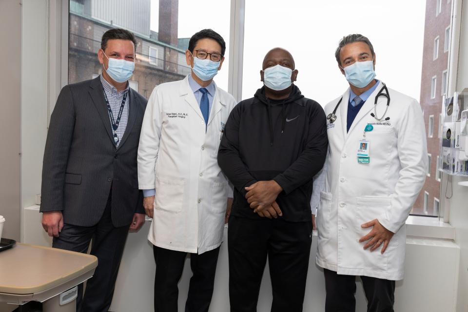 Rick Slayman with doctors and staff members at the Massachusetts General Hospital on April 3, 2024, the day of his discharge.