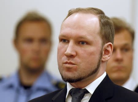 Norwegian mass killer Anders Behring Breivik (C) arrives to hear the verdict in his trial at a courtroom in Oslo in this August 24, 2012 file photo. REUTERS/Stoyan Nenov/Files