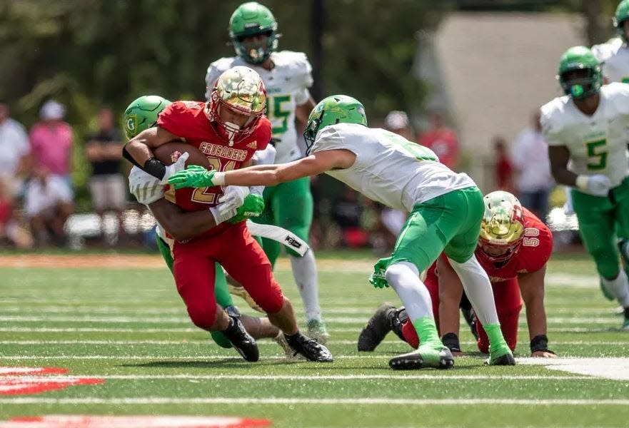 Bergen Catholic's Anthony Perrotti carries the ball during a game against Cardinal Gibbons on Saturday August 27, 2022. (Anne-Marie Caruso/NorthJersey.com).