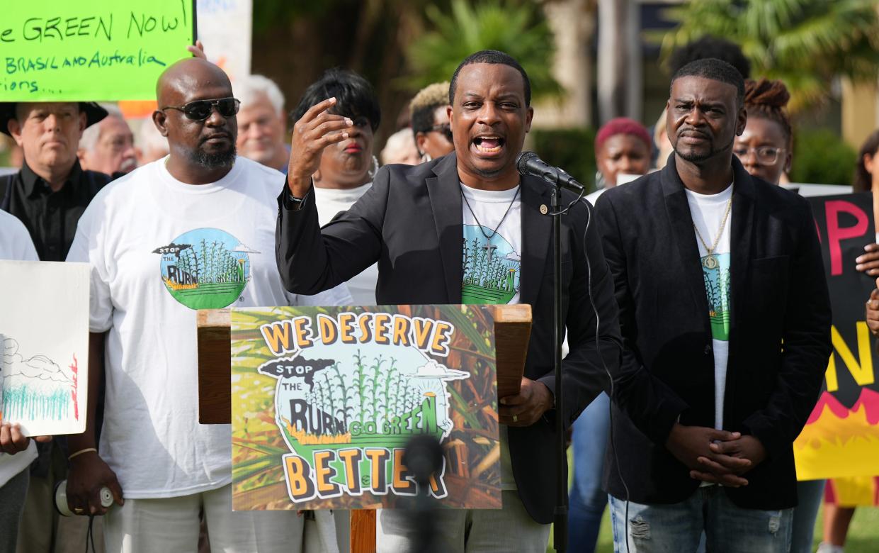 Steve Messam of Stop The Burn leads a protest Saturday in downtown West Palm Beach against the burning of sugar cane during harvest season in the Glades, which the communities say causes dangerous pollution. The protest took place across from Florida Crystals' corporate headquarters.