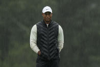 Tiger Woods walks on the 18th hole during the weather delayed second round of the Masters golf tournament at Augusta National Golf Club on Saturday, April 8, 2023, in Augusta, Ga. (AP Photo/Charlie Riedel)