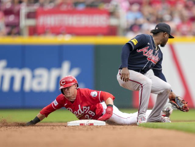 Braves end Reds' 12-game streak in thrilling slugfest