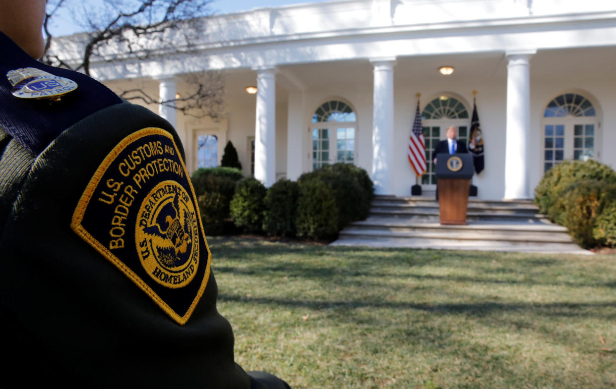 A U.S. Border Patrol agent listens from the front row as President Donald Trump declares a national emergency at the U.S.-Mexico border during remarks about border security in the Rose Garden of the White House in Washington, D.C., Feb. 15, 2019. (Photo: Carlos Barria /Reuters)