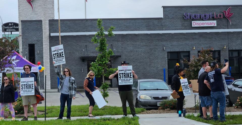 Employees and supporters working to organize a union at Shangri La South dispensary in Columbia picket on May 16 outside the store.