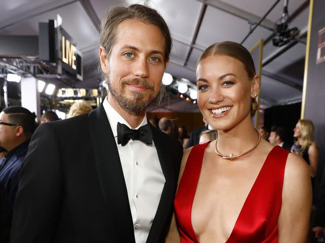 <p>Trae Patton/CBS/Getty </p> Yvonne Strahovski and Tim Loden at the 69th Primetime Emmy Wards on Sept. 17, 2017, in Los Angeles.