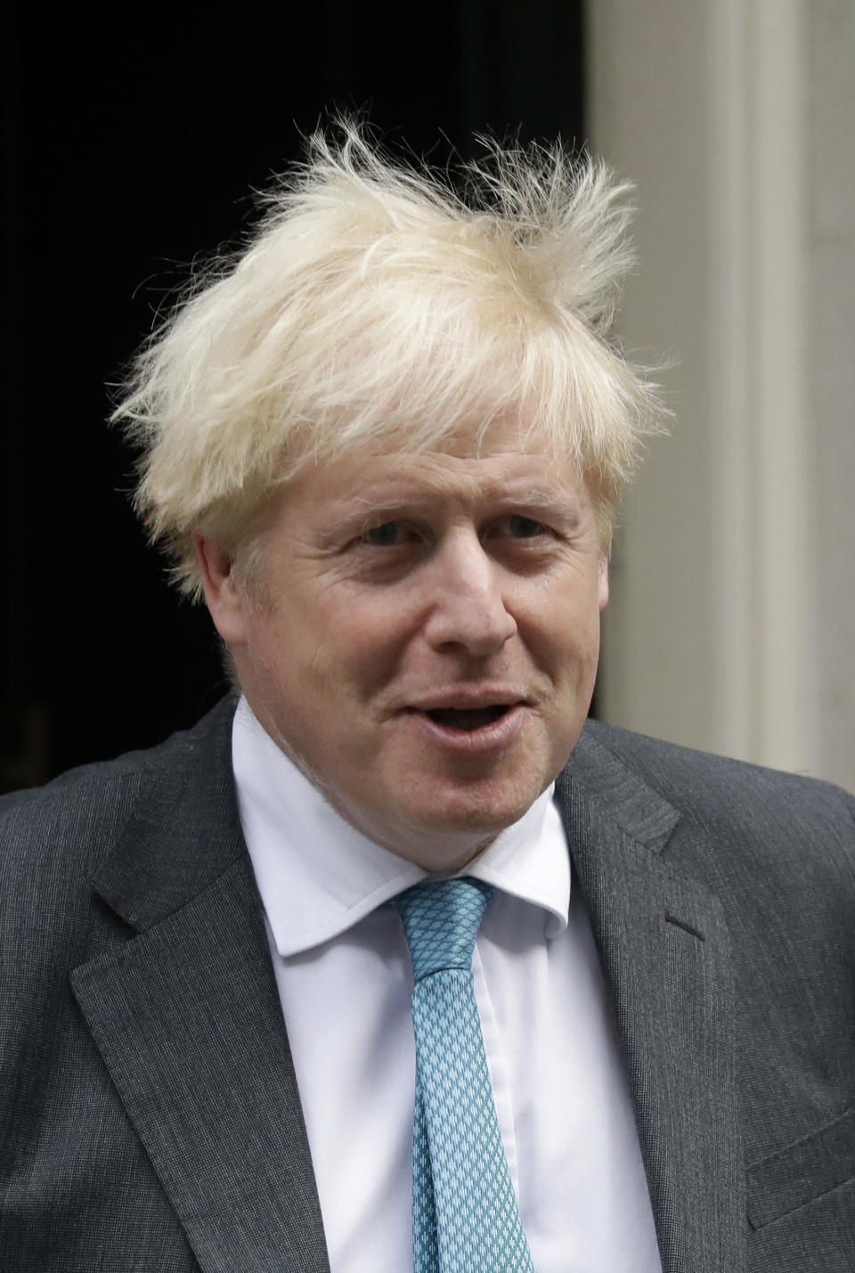 British Prime Minister Boris Johnson leaves 10 Downing Street in London, to attend the weekly Prime Minister's Questions at the Houses of Parliament, in London, Wednesday, Sept. 16, 2020. (AP Photo/Matt Dunham)