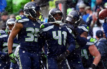 SEATTLE, WA - JANUARY 18: DeShawn Shead #35 and Byron Maxwell #41 of the Seattle Seahawks react during the first half of the 2015 NFC Championship game against the Green Bay Packers. (Photo by Ronald Martinez/Getty Images)