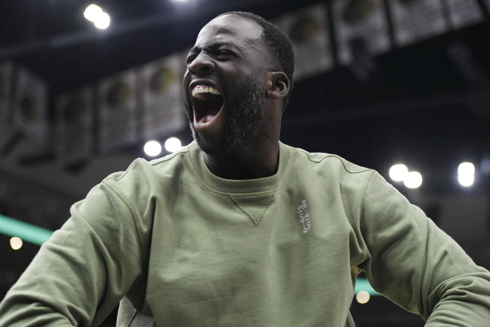 Golden State Warriors' Draymond Green celebrates on the bench during the final minutes of the team's NBA basketball game against the Chicago Bulls on Friday, Jan 12, 2024, in Chicago. The Warriors won 140-131. (AP Photo/Paul Beaty)