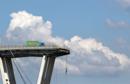 The collapsed Morandi Bridge is seen in the Italian port city of Genoa, Italy August 15, 2018.  REUTERS/Stefano Rellandini