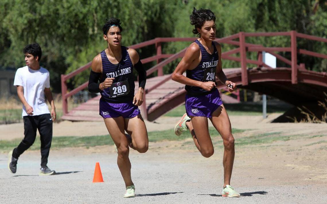 Madera South senior Dylan Devine runs ahead of teammate Isaac Chávez during the Dennis DeWitt Invitational at Lions Town & Country Park in Madera on Aug. 27, 2022. Devine finished second in 9:13.4 and Chávez was third in 9:14.7 on the 3,000-meter course.