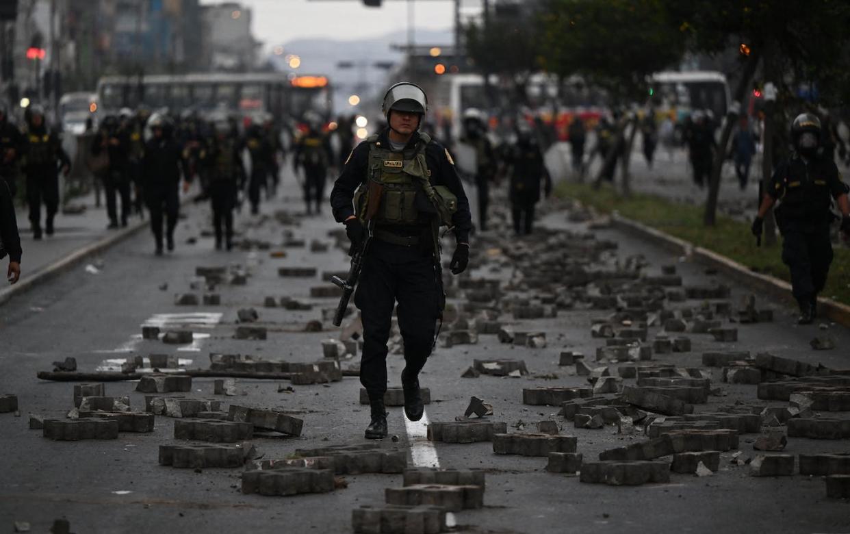 Clashes on the streets of Peru. <a href="https://www.gettyimages.com/detail/news-photo/members-of-the-police-are-seen-during-clashes-with-news-photo/1245445266?phrase=peru%20castillo&adppopup=true" rel="nofollow noopener" target="_blank" data-ylk="slk:Ernesto Benavides/AFP via Getty Images);elm:context_link;itc:0;sec:content-canvas" class="link ">Ernesto Benavides/AFP via Getty Images)</a>