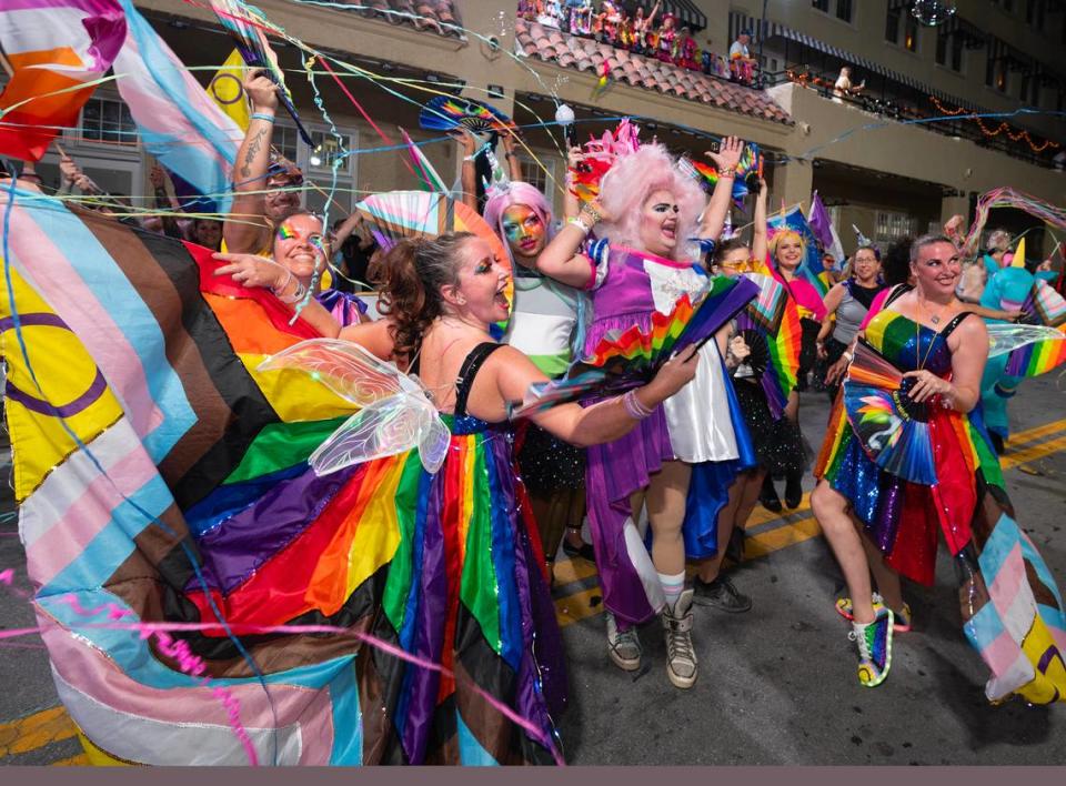 Dancers in lavish rainbow-colored attire perform on Duval Street Saturday, Oct. 28, 2023, in Key West during the Fantasy Fest Parade.