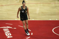 Las Vegas Aces guard Kelsey Plum (10) celebrates after scoring against the New York Liberty during the first half in Game 1 of a WNBA basketball final playoff series Sunday, Oct. 8, 2023, in Las Vegas. (AP Photo/John Locher)