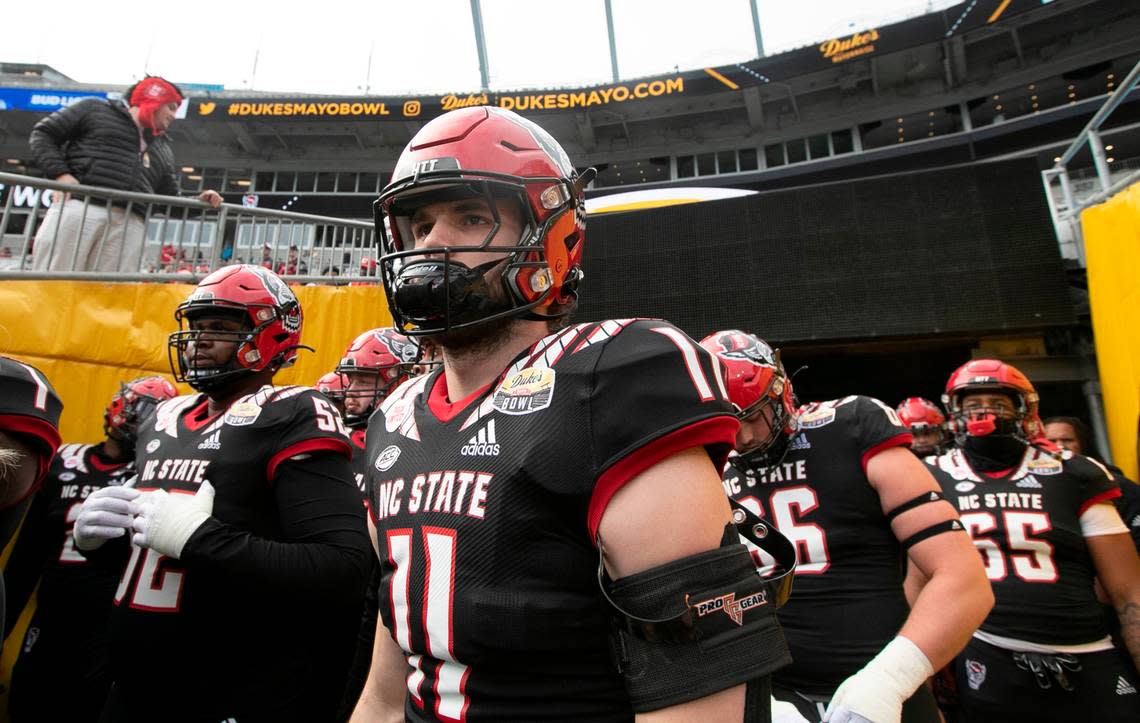 N.C. State linebacker Payton Wilson (11) gets ready to head out onto the field to warmup before N.C. State’s game against Maryland in the Duke’s Mayo Bowl at Bank of America Stadium in Charlotte, N.C., Friday, Dec. 30, 2022.