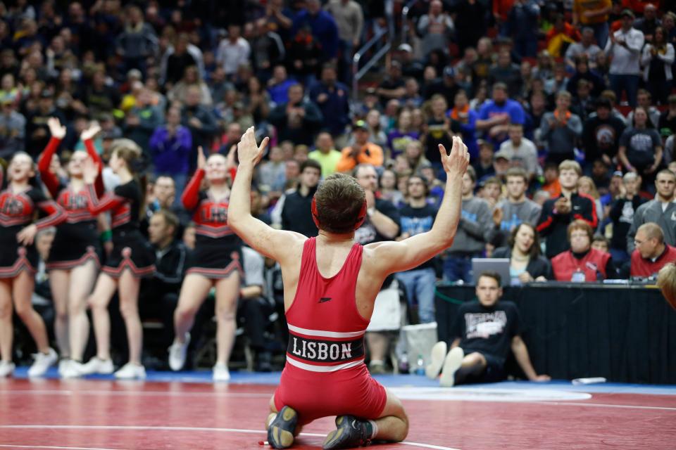 Lisbon's Carter Happel celebrates his win in the 145 title match Saturday, Feb. 20, 2016 during the class 1A state wrestling tournament finals in Des Moines.