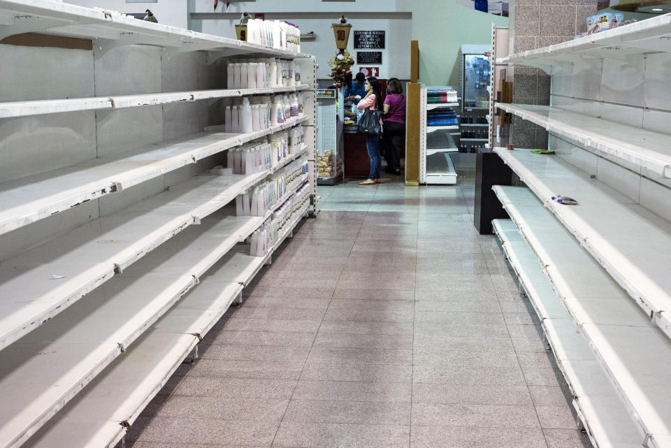 Beauty products sit on otherwise near empty shelves.