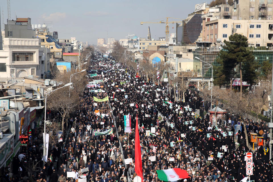 <p>Iranian pro-government supporters march during a rally in support of the regime after authorities declared the end of deadly unrest, in the city of Mashhad on Jan. 4, 2018. (Photo: Nima Najafzadeh/AFP/Getty Images) </p>