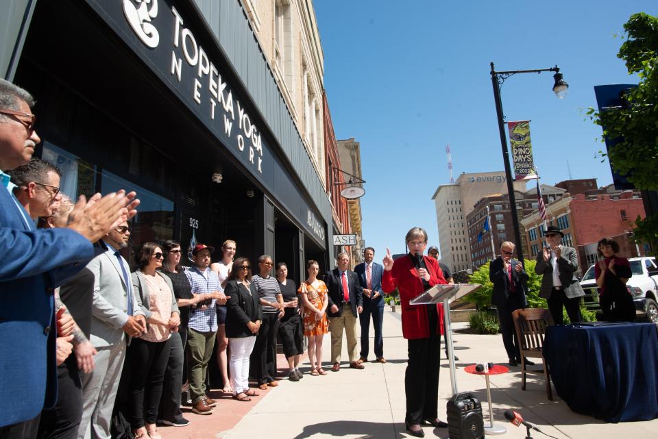 Gov. Laura Kelly delivers remarks on the importance of small local businesses during a bill signing in downtown Topeka.