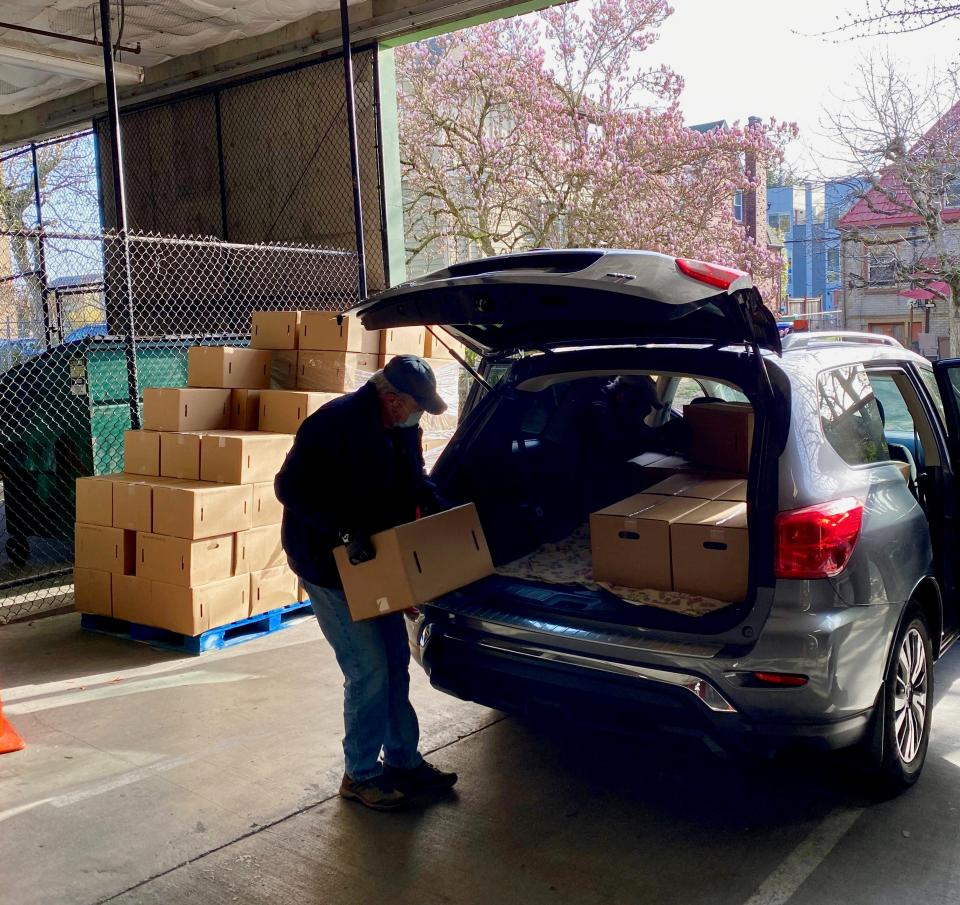Home deliveries are loaded at the West Seattle Food Bank.