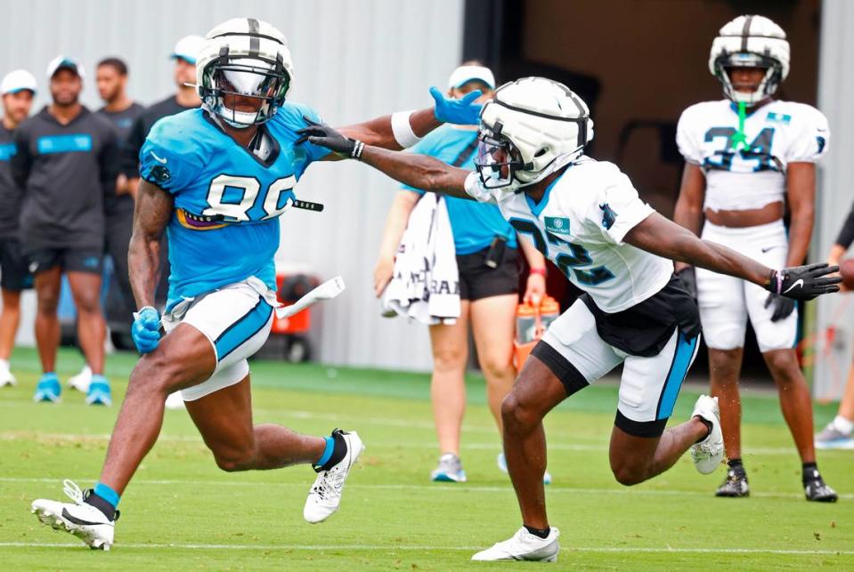 Carolina Panthers wide receiver Terrace Marshall Jr., left, battles cornerback Dicaprio Bootle, right, off the line during practice on Tuesday, August 6, 2024.