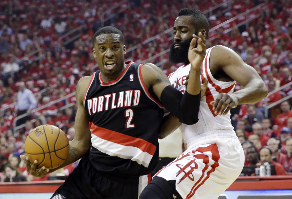 Portland Trail Blazers' Wesley Matthews (2) tries to drive past Houston Rockets' James Harden during the first half in Game 1 of an opening-round NBA basketball playoff series, Sunday, April 20, 2014, in Houston. (AP Photo/David J. Phillip)