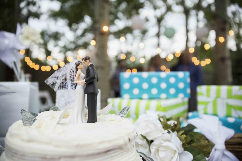 Hero Images/Getty Images A bride and groom cake topper.