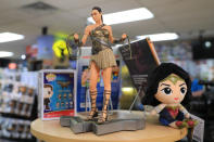 <p>A statue and stuffed figure of Wonder Woman on display at Midtown Comics in New York City. (Gordon Donovan/Yahoo News) </p>