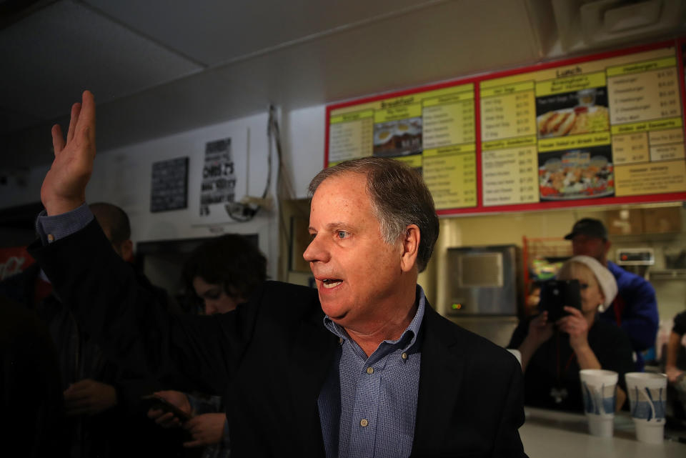 Democratic Senate candidate Doug Jones waves to reporters as he leaves a restaurant in Birmingham, Alabama, Dec. 11, 2017. (Photo: Justin Sullivan via Getty Images)