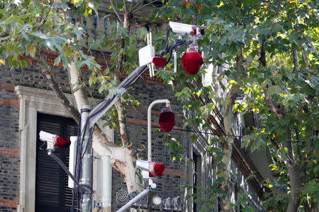 Security cameras covered with red cloth are seen outside the Museum of the First National Congress of the Chinese Communist Party, as China's President Xi Jinping visits the museum, in Shanghai, China, October 31, 2017. REUTERS/Aly Song