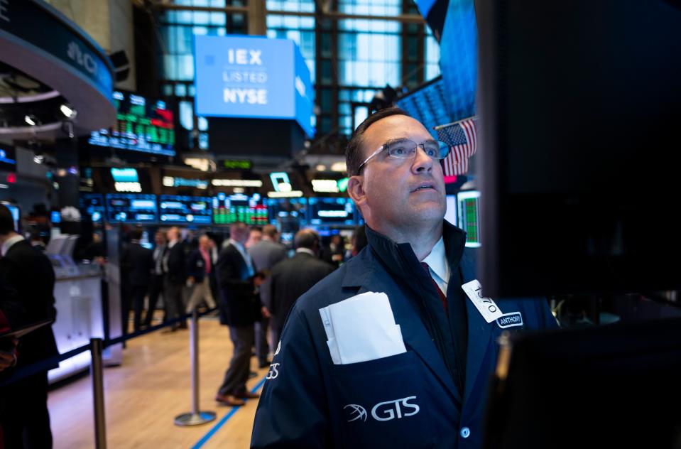 A trader works ahead the opening bell at the New York Stock Exchange (NYSE) on June 18, 2019 located at Wall Street in New York City. (Photo by Johannes EISELE / AFP)        (Photo credit should read JOHANNES EISELE/AFP/Getty Images)