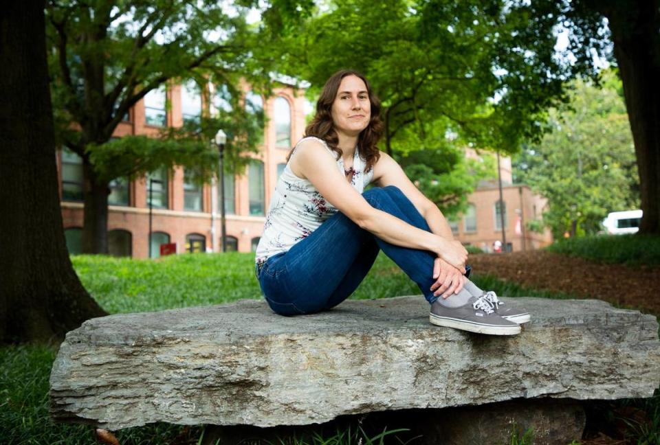 Katie Mack, an astrophysicist and assistant professor of physics at N.C. State University sits for a portrait on campus, on Monday, July 12, 2021, in Raleigh, N.C.