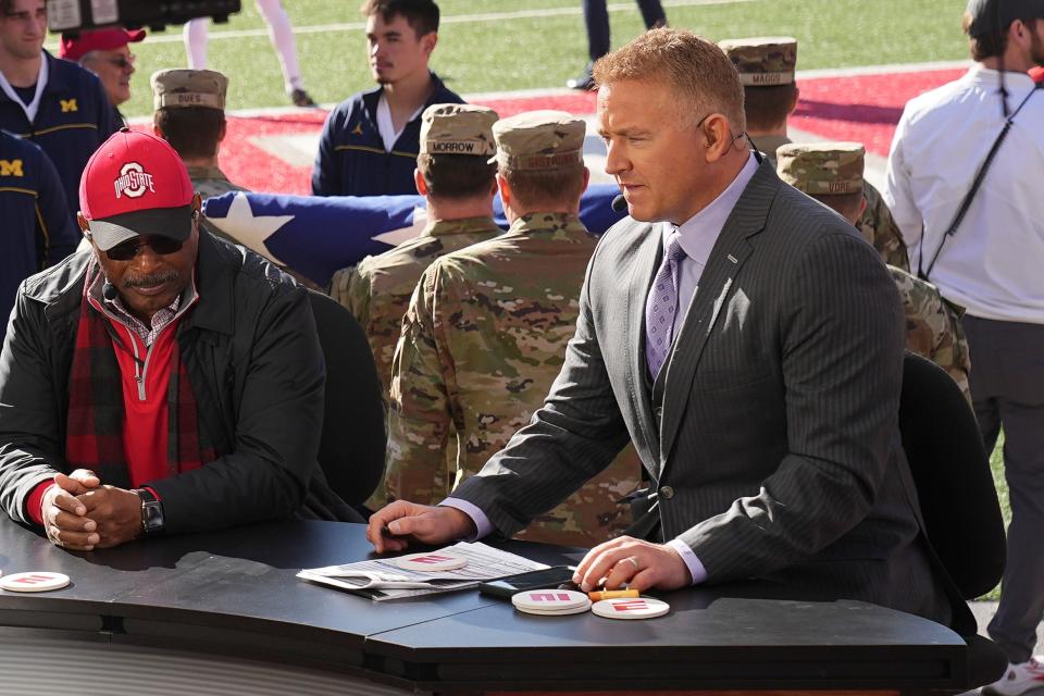 Nov 26, 2022; Columbus, Ohio, USA; Kirk Herbstreit sits beside Archie Griffin on the set of ESPN College GameDay prior to the NCAA football game between the Ohio State Buckeyes and the Michigan Wolverines at Ohio Stadium. Mandatory Credit: Adam Cairns-The Columbus Dispatch