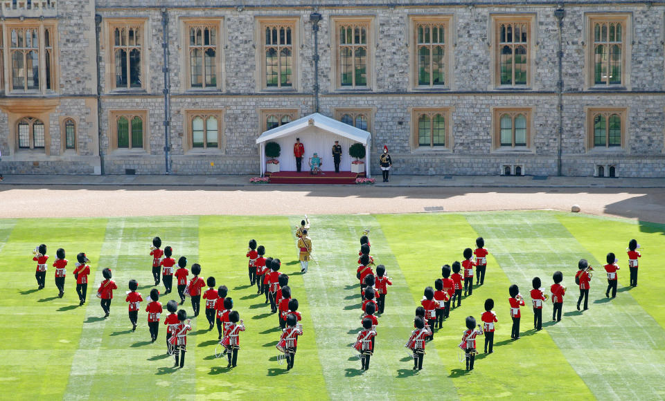 WINDSOR, UNITED KINGDOM - JUNE 13: (EMBARGOED FOR PUBLICATION IN UK NEWSPAPERS UNTIL 24 HOURS AFTER CREATE DATE AND TIME) Queen Elizabeth II attends a military ceremony in the Quadrangle of Windsor Castle to mark her Official Birthday on June 13, 2020 in Windsor, England. It was decided that due to the ongoing COVID-19 Pandemic The Queen's Birthday Parade, known as Trooping the Colour, would not go ahead in it's traditional form at Buckingham Palace and Horse Guards Parade, but a small military ceremony in line with the Government's Social Distancing Guidelines would take place at Windsor Castle instead. Soldiers of 1st Battalion Welsh Guards (whose Colour was due to be Trooped this year) will carry out a series of military drills and Royal Salute. (Photo by Max Mumby/Indigo/Getty Images)