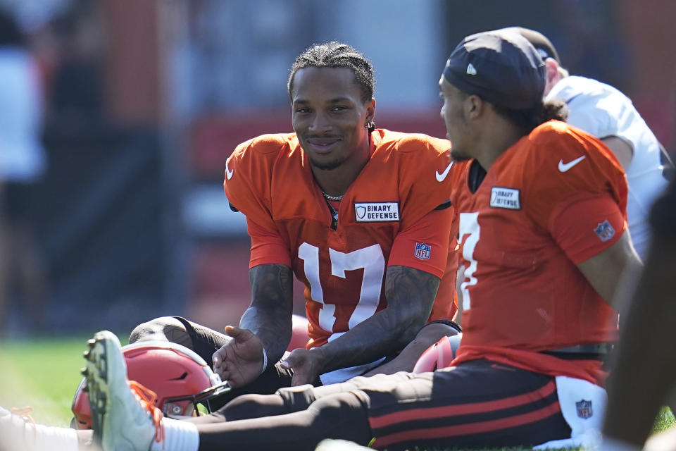 Cleveland Browns quarterbacks Dorian Thompson-Robinson and Kellen Mond, right, talk during an NFL football camp, Sunday, Aug. 20, 2023, in Berea, Ohio. (AP Photo/Sue Ogrocki)